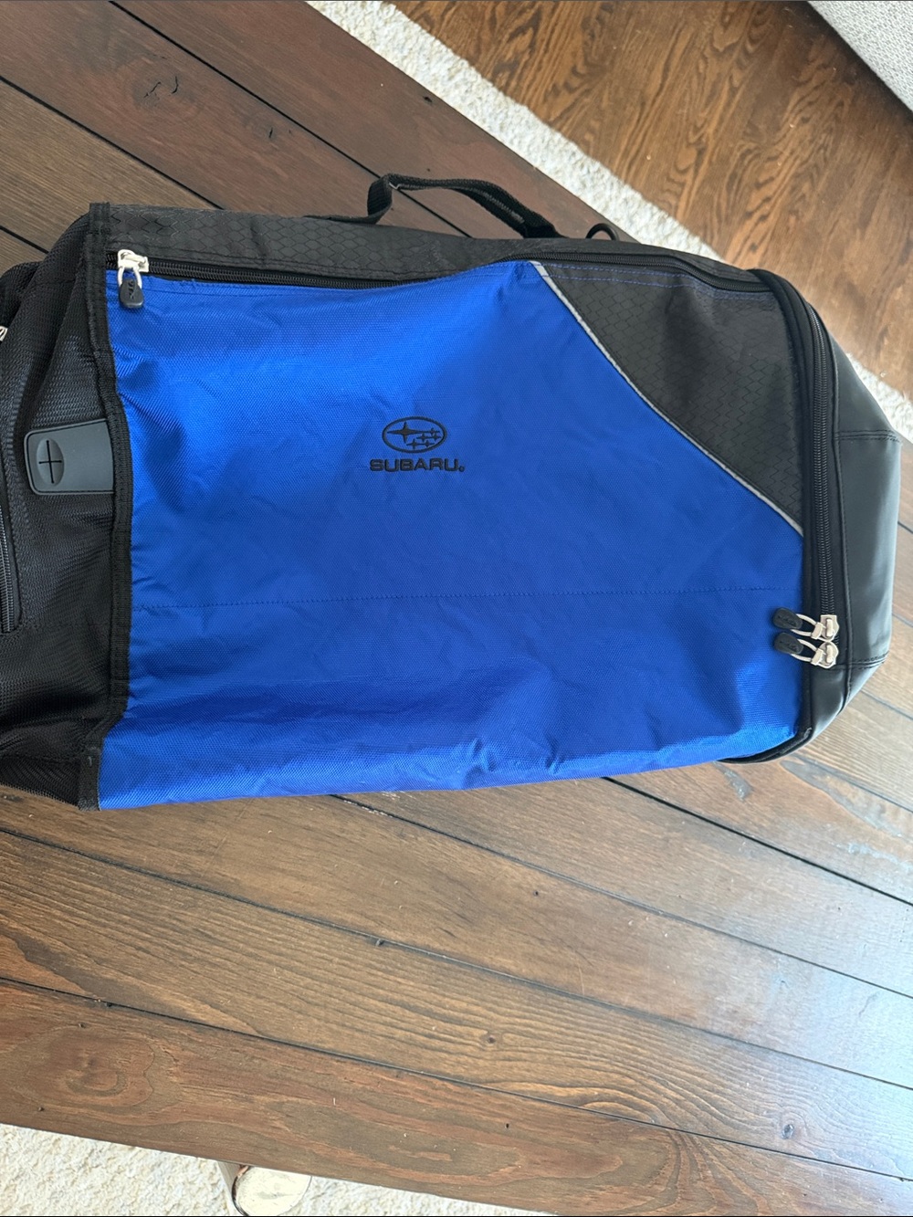 Subaru blue & black duffel bag